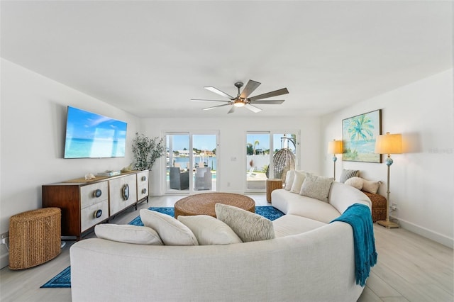 311 22nd St, Belleair Beach, FL 33786 - living area with light wood finished floors and ceiling fan