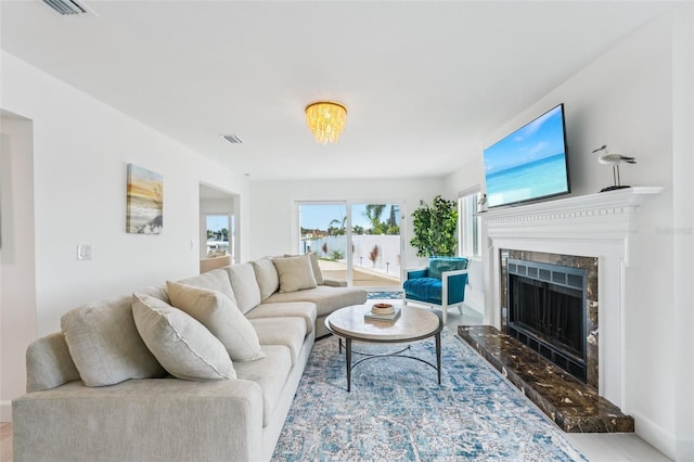 311 22nd St, Belleair Beach, FL 33786 - living area featuring a fireplace and wood finished floors