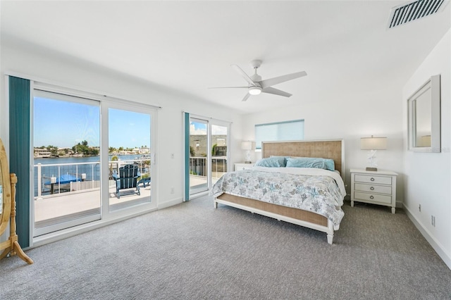 311 22nd St, Belleair Beach, FL 33786 - carpeted bedroom with access to exterior and ceiling fan