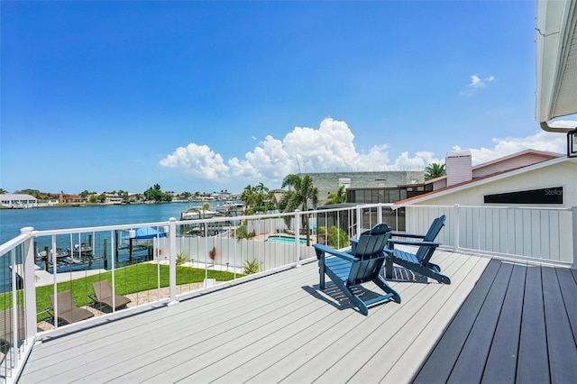 311 22nd St, Belleair Beach, FL 33786 - wooden deck with a water view