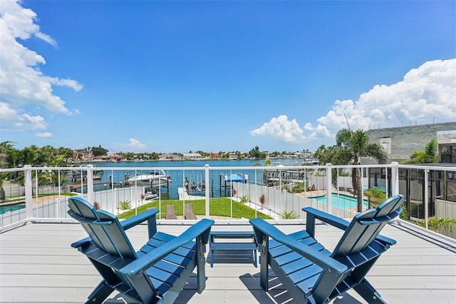 311 22nd St, Belleair Beach, FL 33786 - wooden terrace featuring a water view