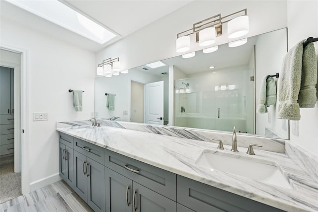 311 22nd St, Belleair Beach, FL 33786 - bathroom with double vanity and a stall shower