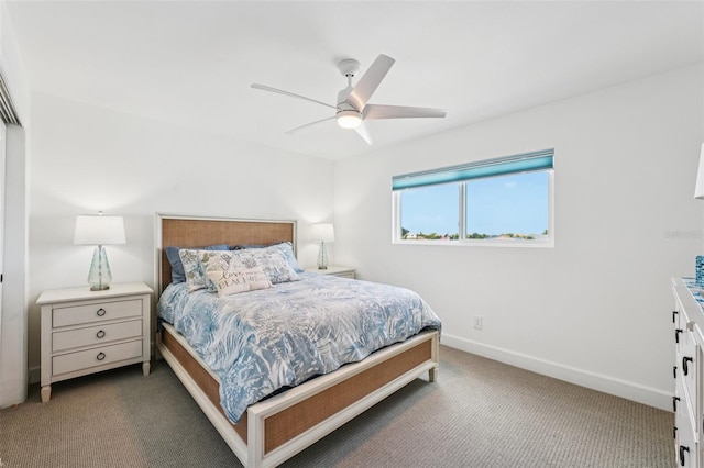 311 22nd St, Belleair Beach, FL 33786 - carpeted bedroom with baseboards and ceiling fan