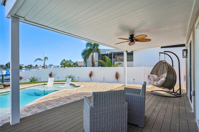 311 22nd St, Belleair Beach, FL 33786 - wooden terrace with a fenced backyard, a patio area, and ceiling fan