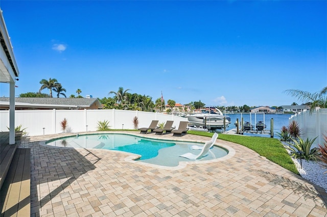 311 22nd St, Belleair Beach, FL 33786 - view of pool with a patio area, a fenced backyard, boat lift, a boat dock, and a water view
