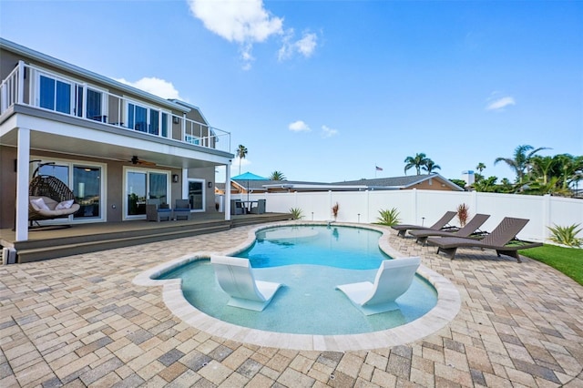 311 22nd St, Belleair Beach, FL 33786 - view of swimming pool with a fenced backyard, a ceiling fan, and a patio