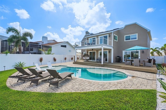 311 22nd St, Belleair Beach, FL 33786 - view of swimming pool with a fenced backyard, an outdoor living space, a ceiling fan, a deck, and a patio