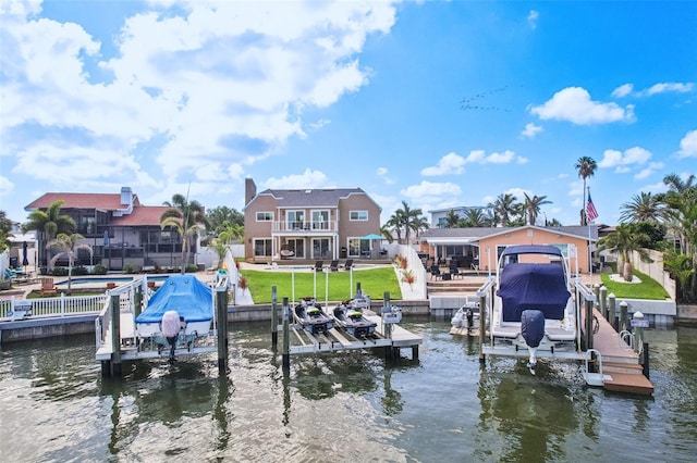 311 22nd St, Belleair Beach, FL 33786 - dock area with boat lift, a water view, and a patio area
