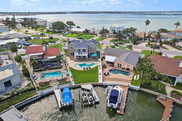 311 22nd St, Belleair Beach, FL 33786 - aerial view of residential area with a pool and a nearby body of water