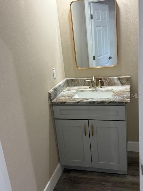 2404 Cassell St, Tampa, FL 33605 - bathroom featuring vanity and wood finished floors
