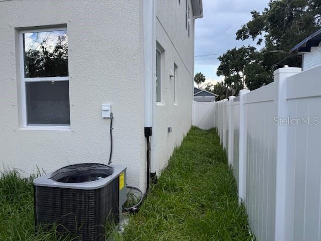 2404 Cassell St, Tampa, FL 33605 - view of home's exterior with stucco siding and a fenced backyard