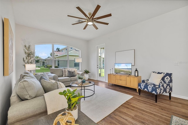 2537 Stanhope Dr, New Port Richey, FL 34655 - living room featuring plenty of natural light, wood finished floors, and a ceiling fan