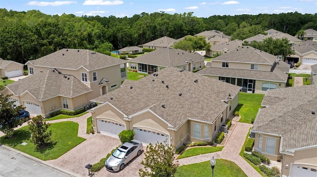 2537 Stanhope Dr, New Port Richey, FL 34655 - aerial perspective of suburban area featuring a forest