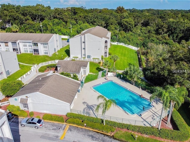 2625 State Road 590 Unit 2514, Clearwater, FL 33759 - drone / aerial view of a pool and a heavily wooded area