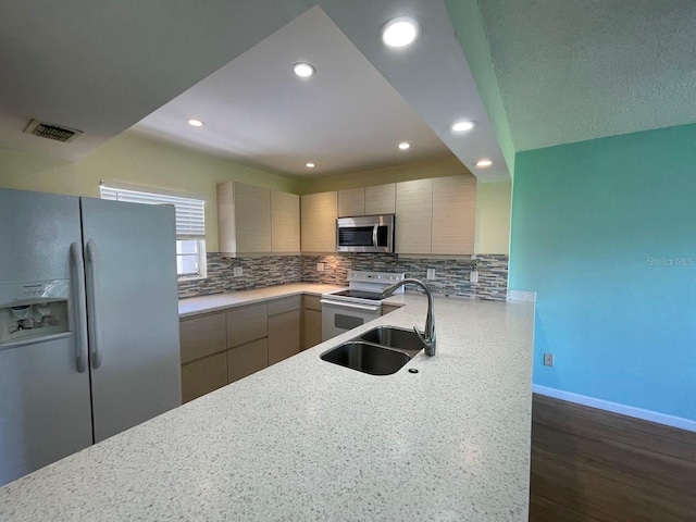 2625 State Road 590 Unit 2514, Clearwater, FL 33759 - kitchen featuring fridge with ice dispenser, stainless steel microwave, electric stove, tasteful backsplash, and modern cabinets
