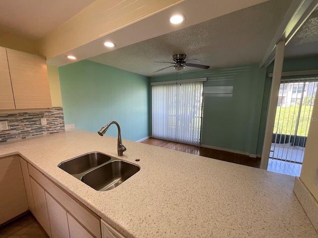 2625 State Road 590 Unit 2514, Clearwater, FL 33759 - kitchen featuring tasteful backsplash, ceiling fan, recessed lighting, a peninsula, and light stone countertops