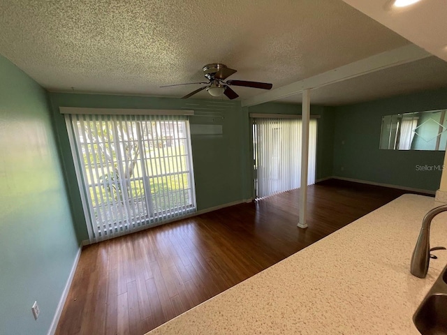 2625 State Road 590 Unit 2514, Clearwater, FL 33759 - unfurnished living room featuring ceiling fan, a textured ceiling, and wood finished floors