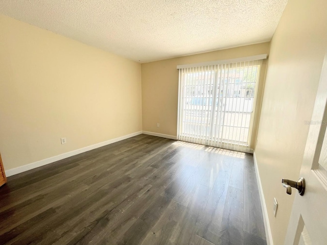 2625 State Road 590 Unit 2514, Clearwater, FL 33759 - unfurnished room with dark wood-type flooring and a textured ceiling