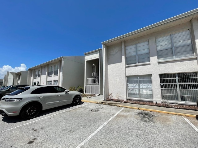 2625 State Road 590 Unit 2514, Clearwater, FL 33759 - view of property featuring uncovered parking