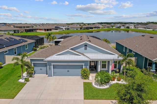 11714 Tetrafin Dr, Riverview, FL 33579 - view of front facade featuring a residential view, an attached garage, and a standing seam roof
