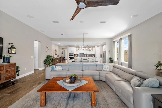 11714 Tetrafin Dr, Riverview, FL 33579 - living area featuring wood finished floors, recessed lighting, and a chandelier