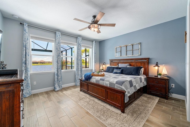 11714 Tetrafin Dr, Riverview, FL 33579 - bedroom featuring light wood-style flooring and a ceiling fan