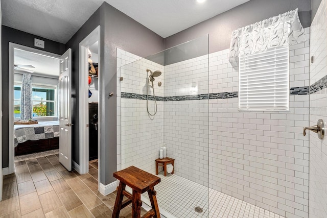 11714 Tetrafin Dr, Riverview, FL 33579 - full bathroom with connected bathroom, tiled shower, and a spacious closet