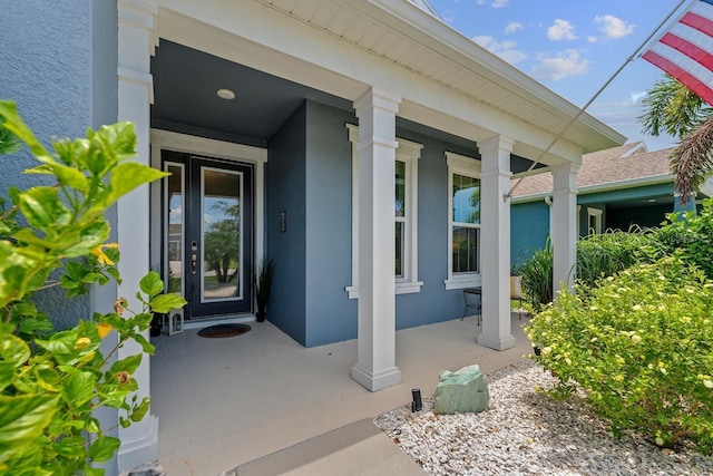 11714 Tetrafin Dr, Riverview, FL 33579 - view of exterior entry featuring a porch and stucco siding