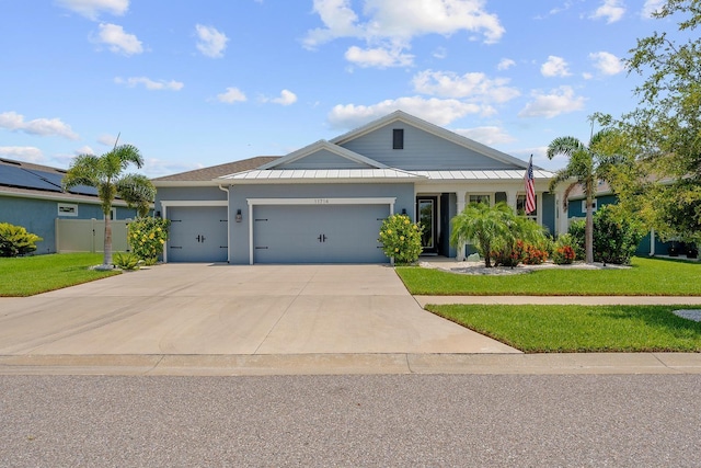 11714 Tetrafin Dr, Riverview, FL 33579 - ranch-style house featuring an attached garage, a front lawn, driveway, and stucco siding