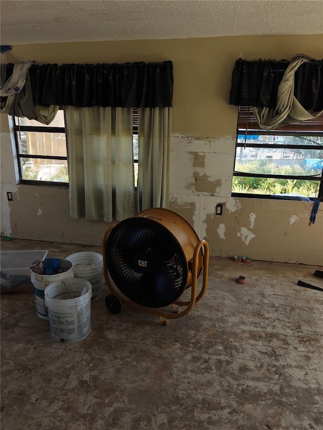 13710 Frances Ave, Hudson, FL 34667 - spare room with plenty of natural light and a textured ceiling