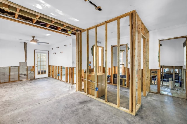 489 W Davis Blvd, Tampa, FL 33606 - miscellaneous room featuring unfinished concrete floors and ceiling fan