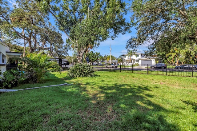 489 W Davis Blvd, Tampa, FL 33606 - view of yard with a residential view and a garage