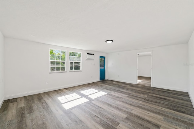 3614 Vasco St, Punta Gorda, FL 33950 - empty room with a wall mounted air conditioner and wood finished floors