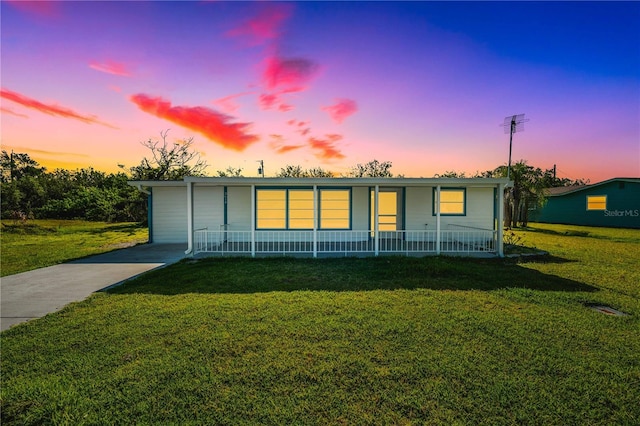 3614 Vasco St, Punta Gorda, FL 33950 - ranch-style house featuring covered porch and a front lawn
