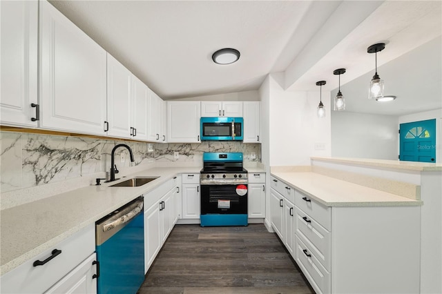 3614 Vasco St, Punta Gorda, FL 33950 - kitchen featuring appliances with stainless steel finishes, a peninsula, backsplash, dark wood finished floors, and light countertops