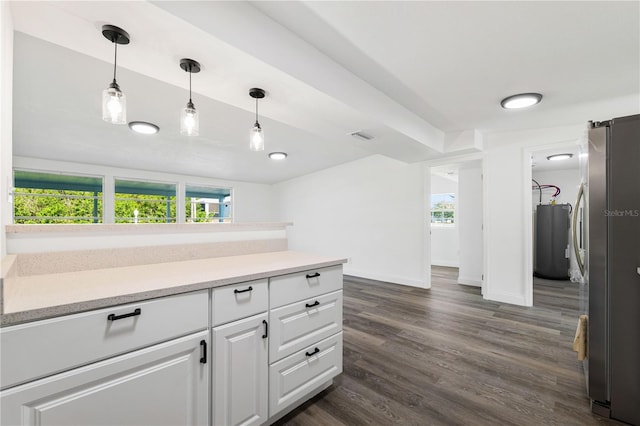 3614 Vasco St, Punta Gorda, FL 33950 - kitchen with freestanding refrigerator, white cabinets, plenty of natural light, and dark wood-style floors