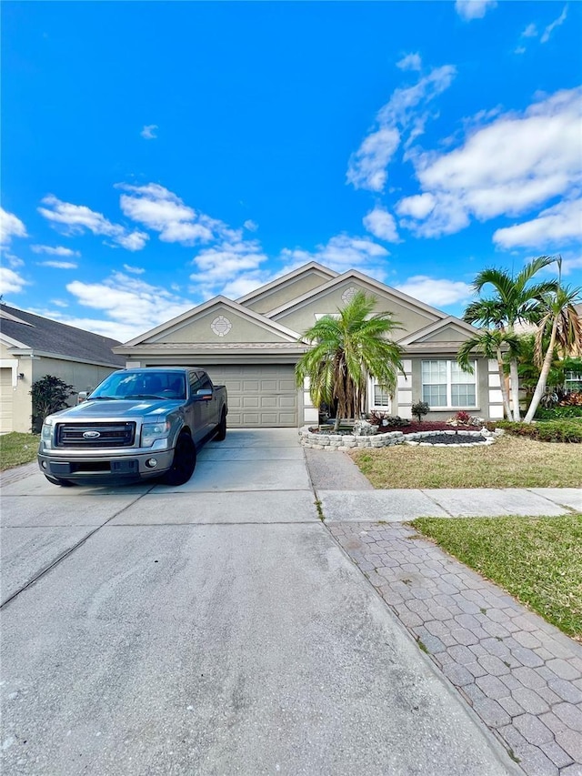 12603 Midpointe, Riverview, FL 33578 - single story home with concrete driveway, an attached garage, a front lawn, and stucco siding