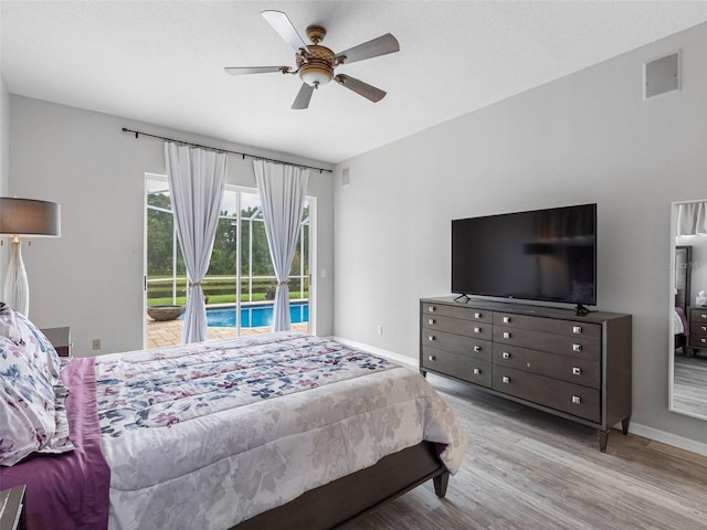 12439 Bristol Commons Cir, Tampa, FL 33626 - bedroom featuring access to outside, light wood-type flooring, and ceiling fan