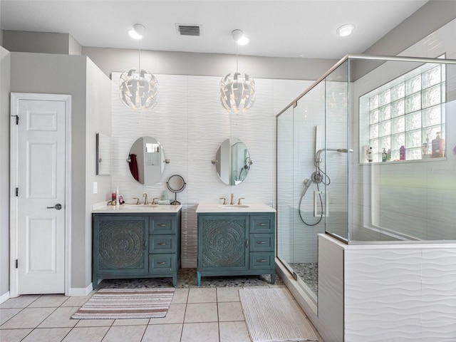 12439 Bristol Commons Cir, Tampa, FL 33626 - full bathroom featuring a chandelier, tile patterned flooring, a stall shower, and vanity