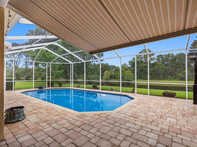 12439 Bristol Commons Cir, Tampa, FL 33626 - outdoor pool with a lanai, view of scattered trees, and a patio