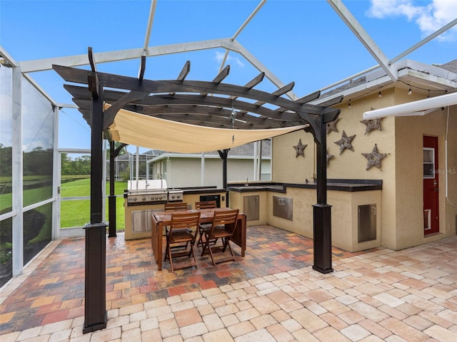 12439 Bristol Commons Cir, Tampa, FL 33626 - view of patio featuring exterior kitchen, glass enclosure, a pergola, and outdoor dining space