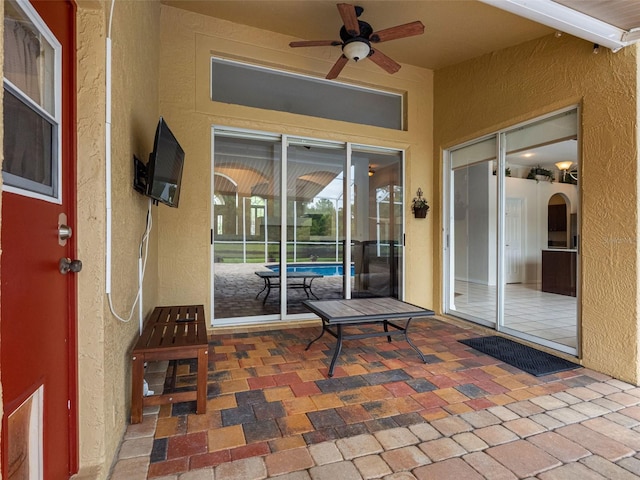 12439 Bristol Commons Cir, Tampa, FL 33626 - view of patio featuring ceiling fan