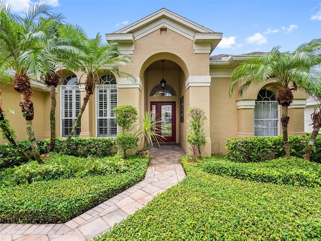 12439 Bristol Commons Cir, Tampa, FL 33626 - property entrance with stucco siding and french doors