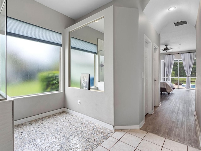 12439 Bristol Commons Cir, Tampa, FL 33626 - hallway featuring baseboards and tile patterned flooring