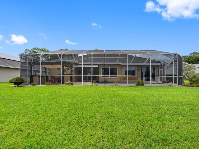 12439 Bristol Commons Cir, Tampa, FL 33626 - rear view of property with a yard