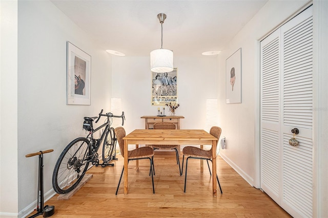 2368 Flanders Way Unit D, Safety Harbor, FL 34695 - dining area with light wood-style flooring and baseboards