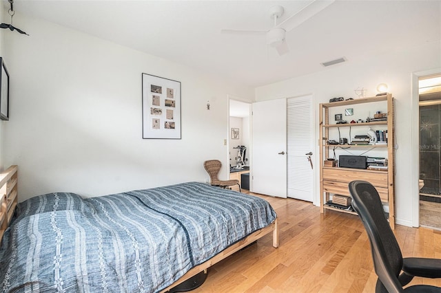 2368 Flanders Way Unit D, Safety Harbor, FL 34695 - bedroom featuring light wood-style flooring, an office area, ceiling fan, and a closet