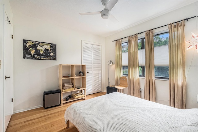 2368 Flanders Way Unit D, Safety Harbor, FL 34695 - bedroom featuring a closet, light wood-type flooring, and a ceiling fan
