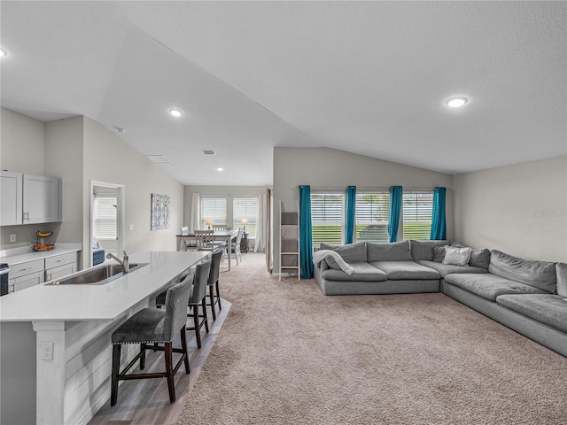 13105 Fruitville Way, Riverview, FL 33579 - living room featuring lofted ceiling, recessed lighting, and light colored carpet