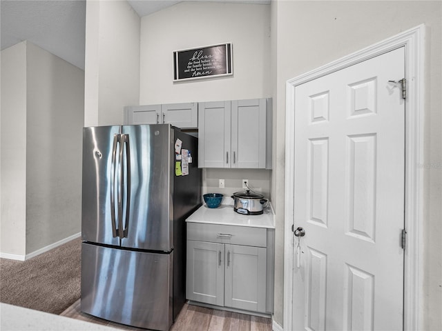 13105 Fruitville Way, Riverview, FL 33579 - kitchen with freestanding refrigerator, gray cabinetry, and light countertops
